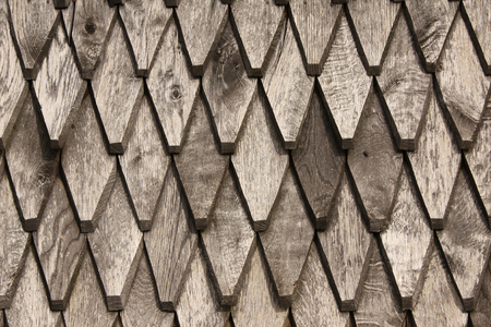 An ancient wooden tiled roof, traditional for the historical area Maramures, Romania, Europeの写真素材