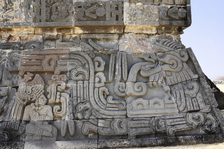 Bas-relief carving with of a american indian chieftain and god Quetzalcoatl, pre-Columbian Maya civilization, Temple of the Feathered Serpent in Xochicalco, Mexico.の写真素材