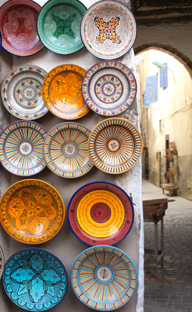 Traditional moroccan souvenirs - plates and pots made of clay, souk in Essaouira, Morocco, North...