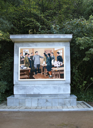 NORTH KOREA, PYHENSON - SEPTEMBER 19, 2017: Stele with pictureのeditorial素材
