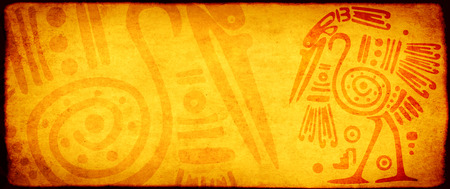 Background with grunge paper texture of yellow color and American Indian traditional patterns with heron. Copy space for textの写真素材