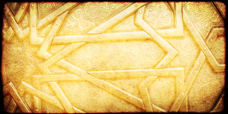 Grunge background with paper texture and detail of an ancient ornamental carved floral ornament in the moroccan style, Morocco, North Africaの写真素材