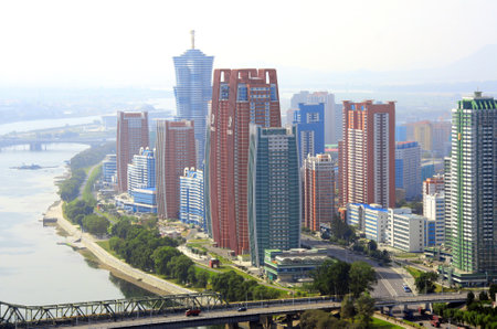 NORTH KOREA, PYONGYANG - SEPTEMBER 25, 2017: Aerial view of new residential complex and Daedong...