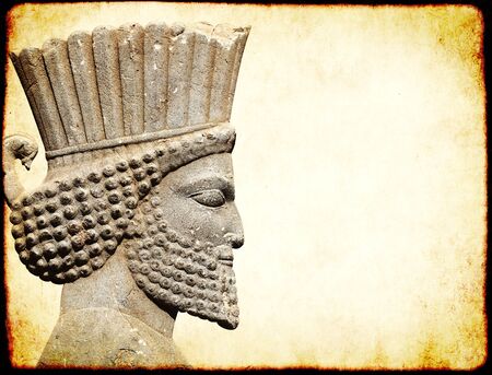 Grunge background with paper texture and bas-relief of head of persian warrior. Copy space for text. Mock up templateの写真素材