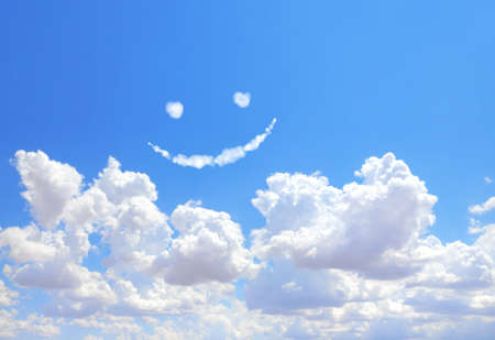 Happy concept. Smilie from white cloud in the blue sky