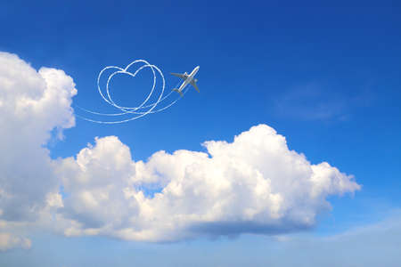 Aircraft draw a heart in the sky. Flight route of aircraft in shape of a heart. Love concept for...