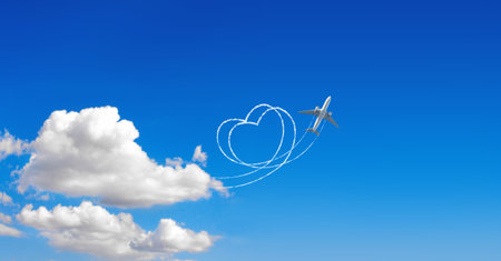 Aircraft draw a heart in the sky. Flight route of aircraft in shape of a heart. Love concept for traveling the worldの写真素材