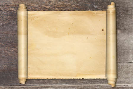 Scroll of old parchment on vintage wooden board. Copy space for your text. Mock up template. 3d renderの写真素材