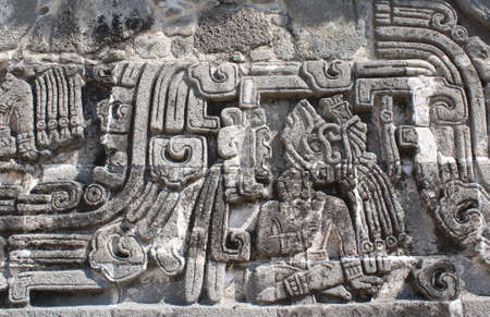 Bas-relief carving with of a american indian chieftain, pre-Columbian Maya civilization, Temple of the Feathered Serpent in Xochicalco, Mexico.の写真素材
