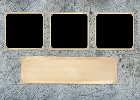 Three retro photos on cardboard photo album page. Vintage blank photo frames and empty paper sheet...