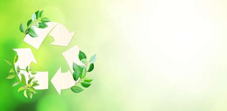 Ecology and zero waste concept. Arrows recycle symbol and green leaves on blurred green background. Horizontal banner with eco paper texture. Copy space for text. Mock up templateの写真素材