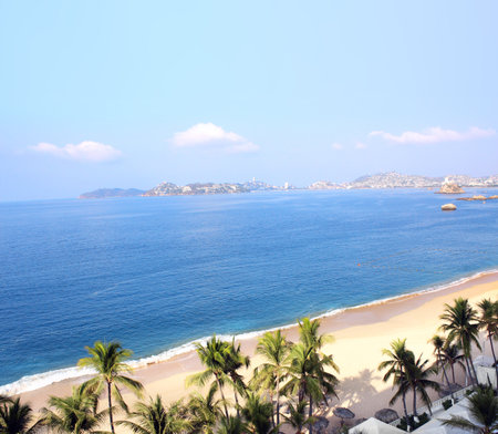 Aerial view on palms, ocean waves and beach, Acapulco de Juarez, Mexico, the Pacific Ocean, North Americaの写真素材