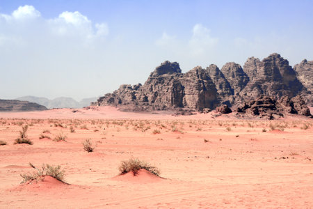 Beautiful landscape with red sand and rocky mountains in Wadi Rum desert (Valley of the Moon), Jordan.の写真素材