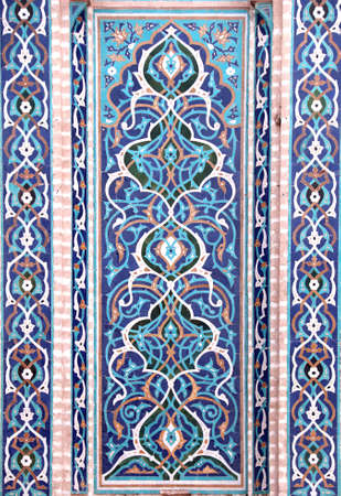 Detail of traditional persian mosaic wall with floral ornament, Grand Jame Mosque (Masjid-e Jameh Mosque, Friday Mosque), Yazd, Iran. Wall with ceramic tile of blue, cian, brown and white colorsの写真素材