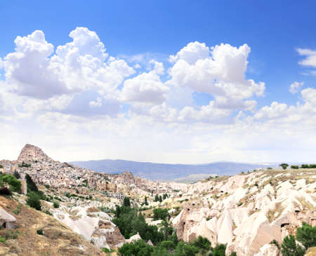 Carved houses in rock in Pigeon Valley, Uchisar, Cappadocia, Turkeyの写真素材