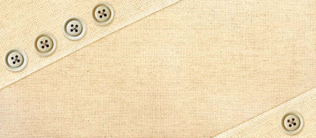 Horizontal or vertical background with beige canvas texture and buttons. Natural linen texture backdrop. Copy space for textの写真素材