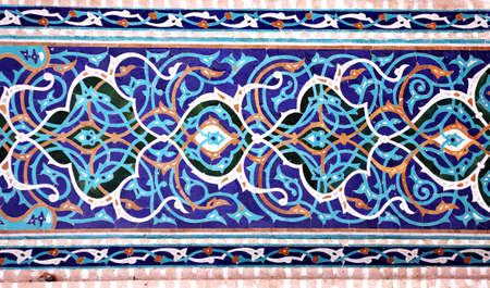 Detail of traditional persian mosaic wall with floral ornament, Grand Jame Mosque (Masjid-e Jameh Mosque, Friday Mosque), Yazd, Iran. Wall with ceramic tile of blue, cian, brown and white colorsの写真素材