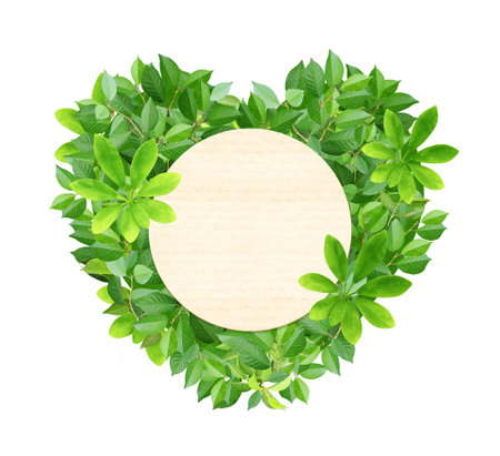 Responsible consumption. Heart made from green leaves and round label from recycled paper. Eco-friendly business. Love of nature. Ecology and zero waste concept. Isolated on white backgroundの写真素材