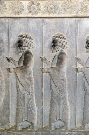 Ancient wall with bas-relief with assyrian warriors with spears, Persepolis, Iran.の写真素材