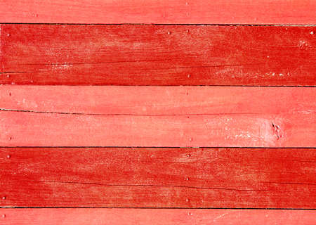 Horizontal or vertical texture of old wooden planks painted with red paintの写真素材