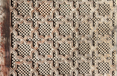 Detail of wooden door with traditional islamic ornament. Wood window shutter with antique and national moroccan patternの写真素材