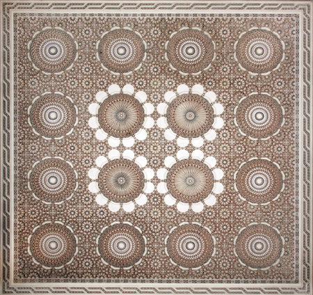 Ancient carved floral ornament in the Moroccan style. Square bas-relief with decorative elements in arabic styleの写真素材
