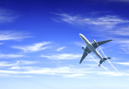 Horizontal nature background with aircraft and Jet trailing smoke in the sky. Airplane and condensation trail. Foggy trail jet and plane in blue sky with white clouds. Traveling the world conceptの写真素材