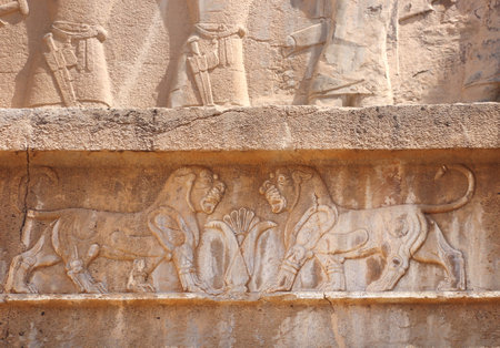 Bar-relief depicting two lions above the entrance to the tomb of Artaxerxes III, located on the slope of Rahmet Mount, Persepolis, Iran. UNESCO world heritage siteのeditorial素材
