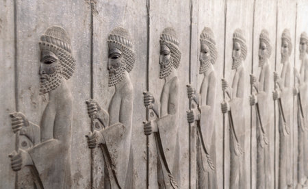 Ancient wall with bas-relief with assyrian warriors with spears, Persepolis, Iran. UNESCO world heritage siteのeditorial素材