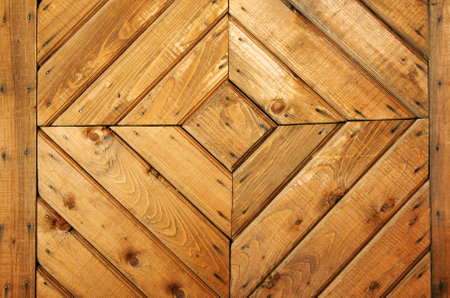 Detail of medieval window shutter with square elements and beautiful wooden textureの写真素材