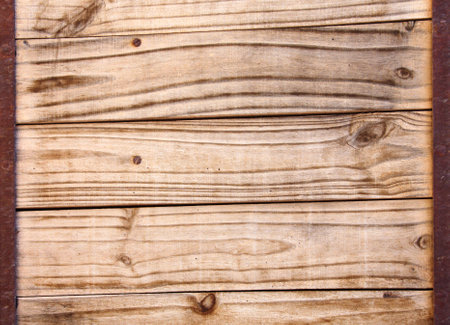 Texture of ancient wood with metal frame. Vintage wooden boards with rusted metal planks. Mock up template. Copy space for textの写真素材