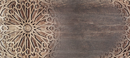 Grunge background with wood texture and ancient carved ornament, Morocco. Horizontal or vertical banner with ornament in Moroccan style. Mock up template. Copy space for textの写真素材