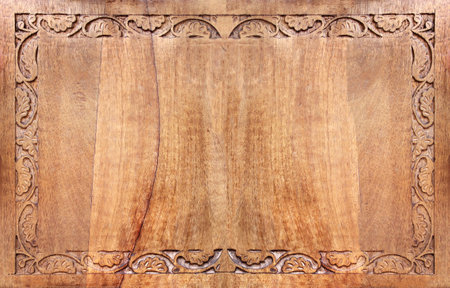 Horizontal background with wood carving floral ornament. Decorative carved border on wooden surface. Mock up template. Copy space for textの写真素材