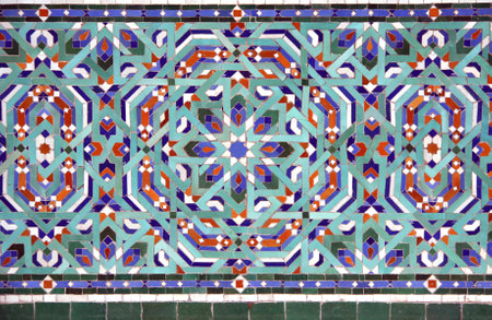 Detail of ancient mosaic wall with geometric ornaments. Horizontal or vertical background with traditional moroccan tile decorationの写真素材
