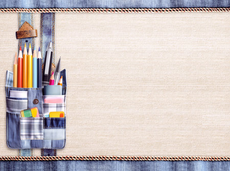 Back to school. Pencils and pens in denim pocket. Jeans pocket with office supplies. Education concept. Horizontal background with linen and denim texture. Mock up template. Copy space for textの写真素材