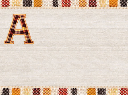 Back to school. Horizontal background with letter A made of plaid fabric and striped border on linen texture. Mock up template. Copy space for textの写真素材