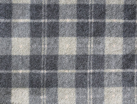 Fleece texture background with plaid pattern of grey dark grey and light grey colors. Gray fleece fabric texture with checkered patternの写真素材