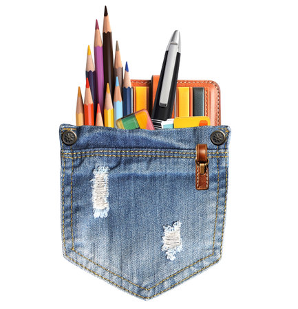 Back to school. Pencils and pens in denim pocket. Jeans pocket with office supplies. Education concept. Isolated on white backgroundの写真素材