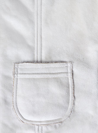 Vertical backdrop with pocket on suede texture of ivory color. Template background for scrapbooking design, decoration with suede leather and pocket of light beige color. Copy space for textの写真素材