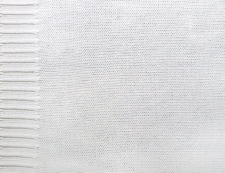 Wool sweater texture of white color with  border. Natural knitted wool material. Horizontal or vertical background with knitted fabric textureの写真素材