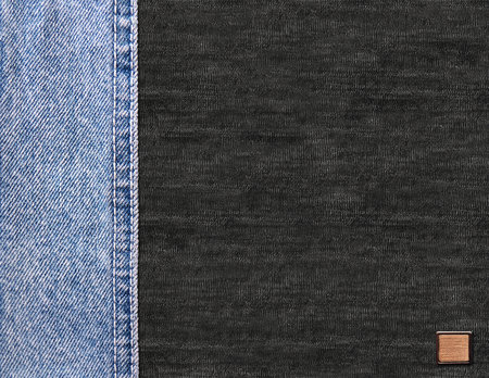 Horizontal background with blue denim borders with a seam, leather label and black cotton texture. Decorative backdrop with light blue and gray color denim jeans fabric. Copy space for textの写真素材