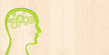 Head of a man with gears in the shape of the brain in paper cut style. Horizontal banner with eco paper texture. Paper cardboard background. Ecology and zero waste concept. Copy space for textの写真素材