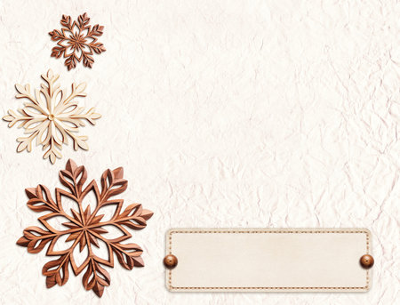 Eco friendly Christmas. Christmas background with paper tag and wooden snowflakes on paper. Mock up template. Copy space for text. Ecology, environmental conservation and zero waste concept. 3d renderの写真素材