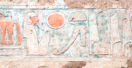 Ancient Colorful Mural Wall Painting inside Hatshepsut Temple in Valley of the Kings, Luxor, Egypt. Ancient Egyptian hieroglyphs, wall of the Hatshepsut temple in Western Thebesの写真素材