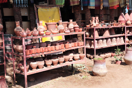 Traditional nubian souvenirs - handmade clay jugs. Homemade pottery at a street market in a Nubian village near Aswan, Egyptの写真素材