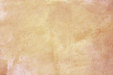 Grunge background with old stucco wall texture of light brown colorの写真素材