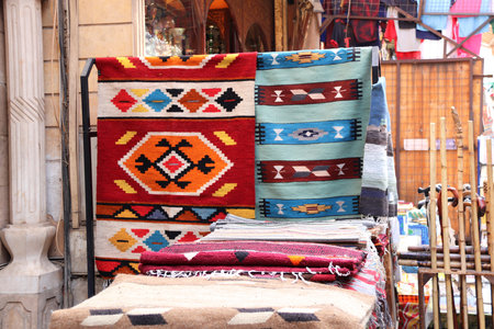 Multicolored carpets on outdoor market on Khan Al-Khalili Bazaar, Cairo, Egypt. Beautiful handmade rugs on the open market bazaarの写真素材