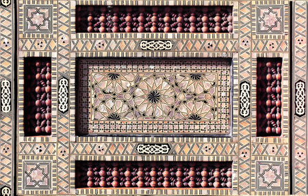 Detail of ancient mosaic window shutter with mother-of-pearl and wood ornaments. Horizontal or vertical background with traditional moroccan tile decorationの写真素材