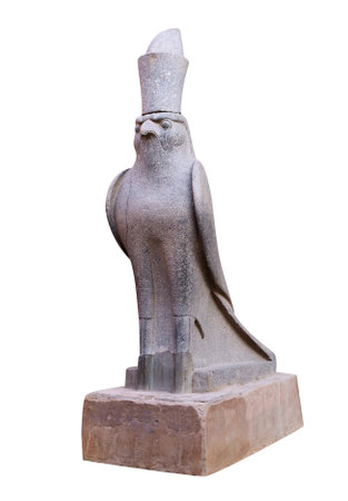 Granite statue of God Horus falcon at entrance Temple of Horus, Edfu, Egypt. Isolated on white backgroundの写真素材