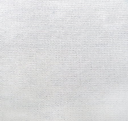 Wool sweater texture of white color. Natural knitted wool material. Horizontal or vertical background with knitted fabric textureの写真素材